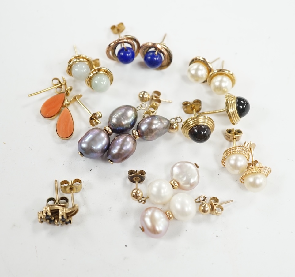 Seven assorted modern pairs of 9ct and gem set earrings and two similar yellow metal pairs. Condition - fair